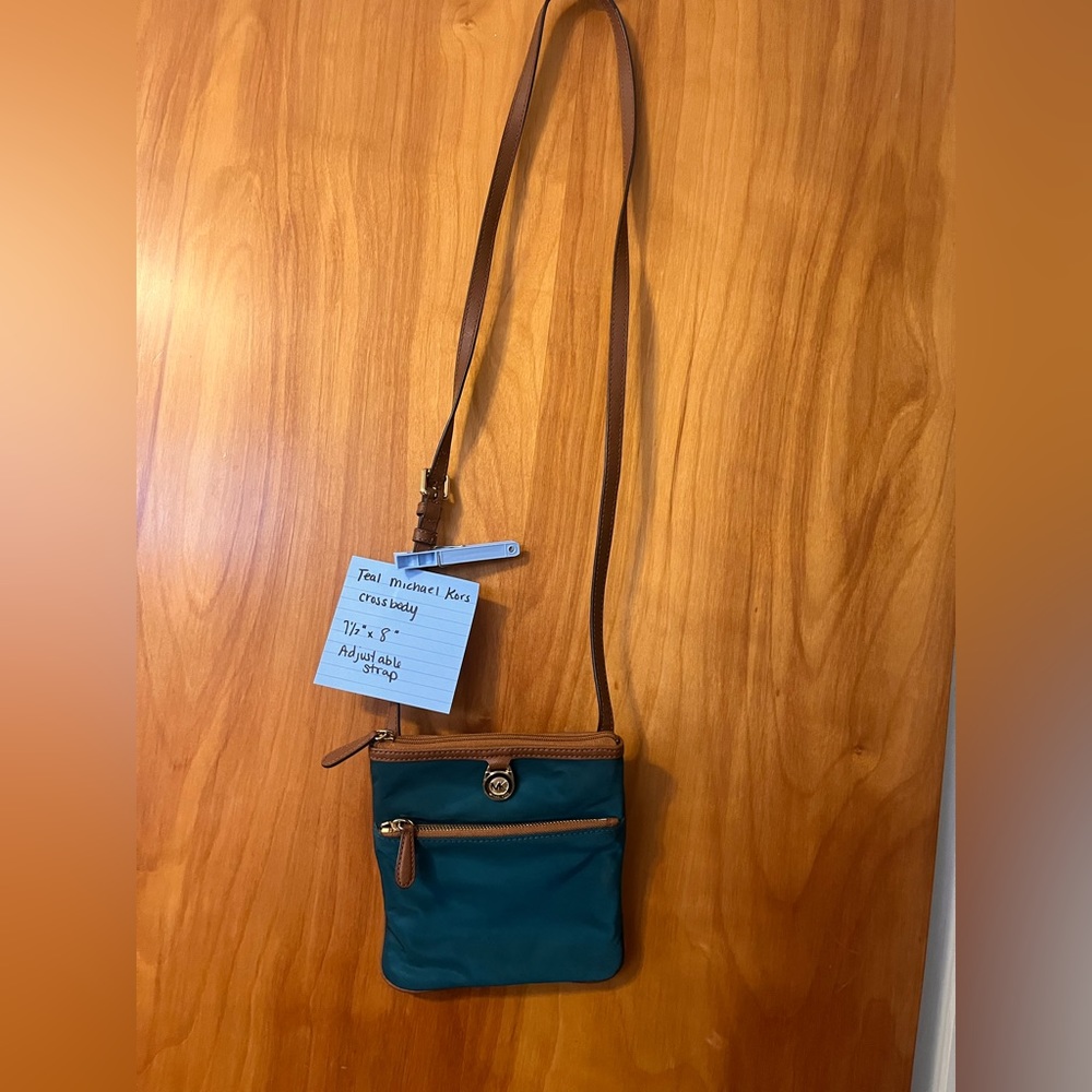 Teal, Michael Kors crossbody, Blemish on back of purse at bottom as pictured
